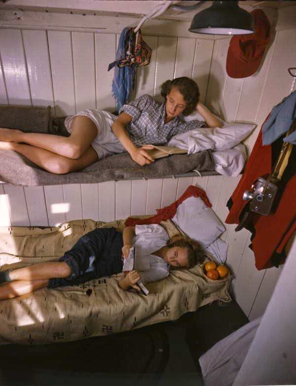 Young women reading aboard the shantyboat Lazy Bones, 1947