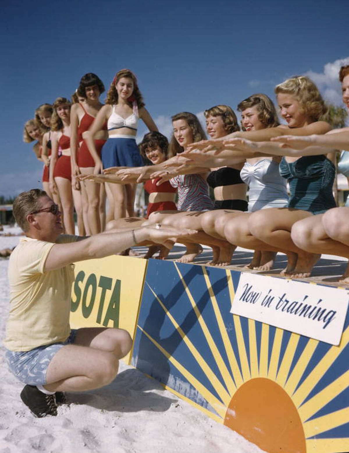 Ballet instructor Ray Ross with the Sarasota Sun-Debs at Lido Beach, Florida, 1940s