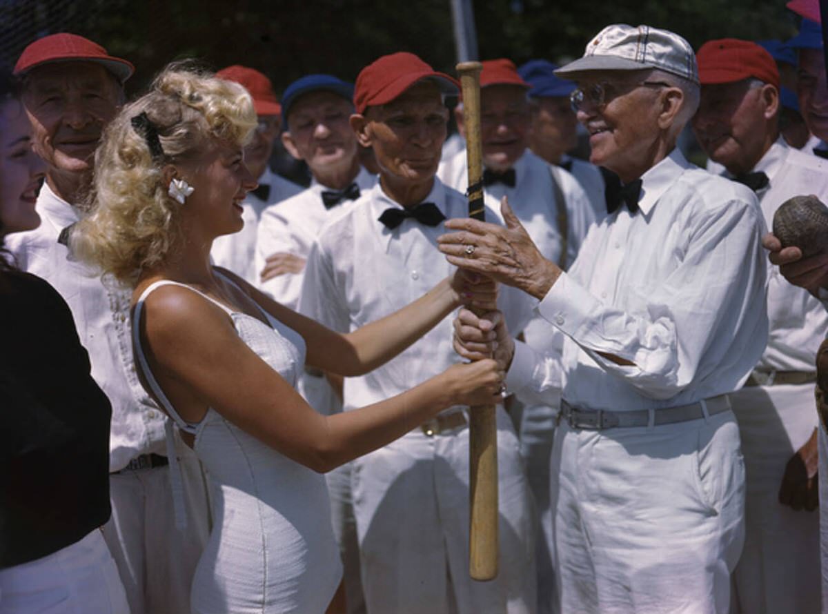 Young women with members of the Three-Quarter Century Softball Club in St. Petersburg, Florida, 1940s