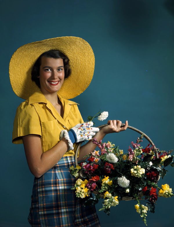 Model with a basket of flowers in Sarasota, Florida, 1945