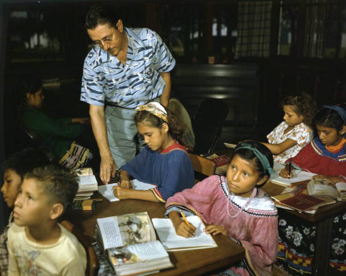William Boehmer teaching Seminole children at the Brighton Indian Day School, 1940s