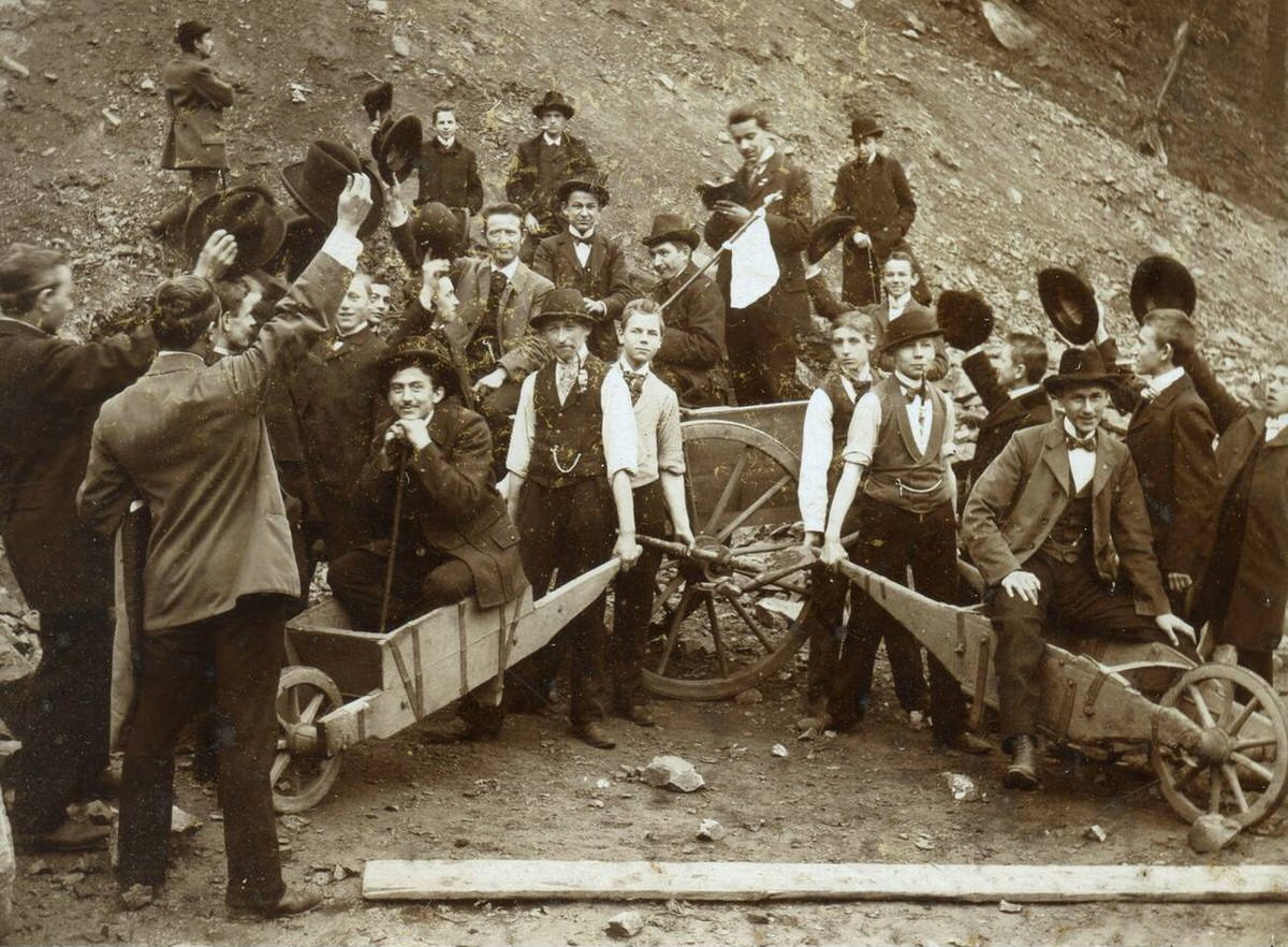 Men and boys with wooden wheelbarrows, Germany, 1910s