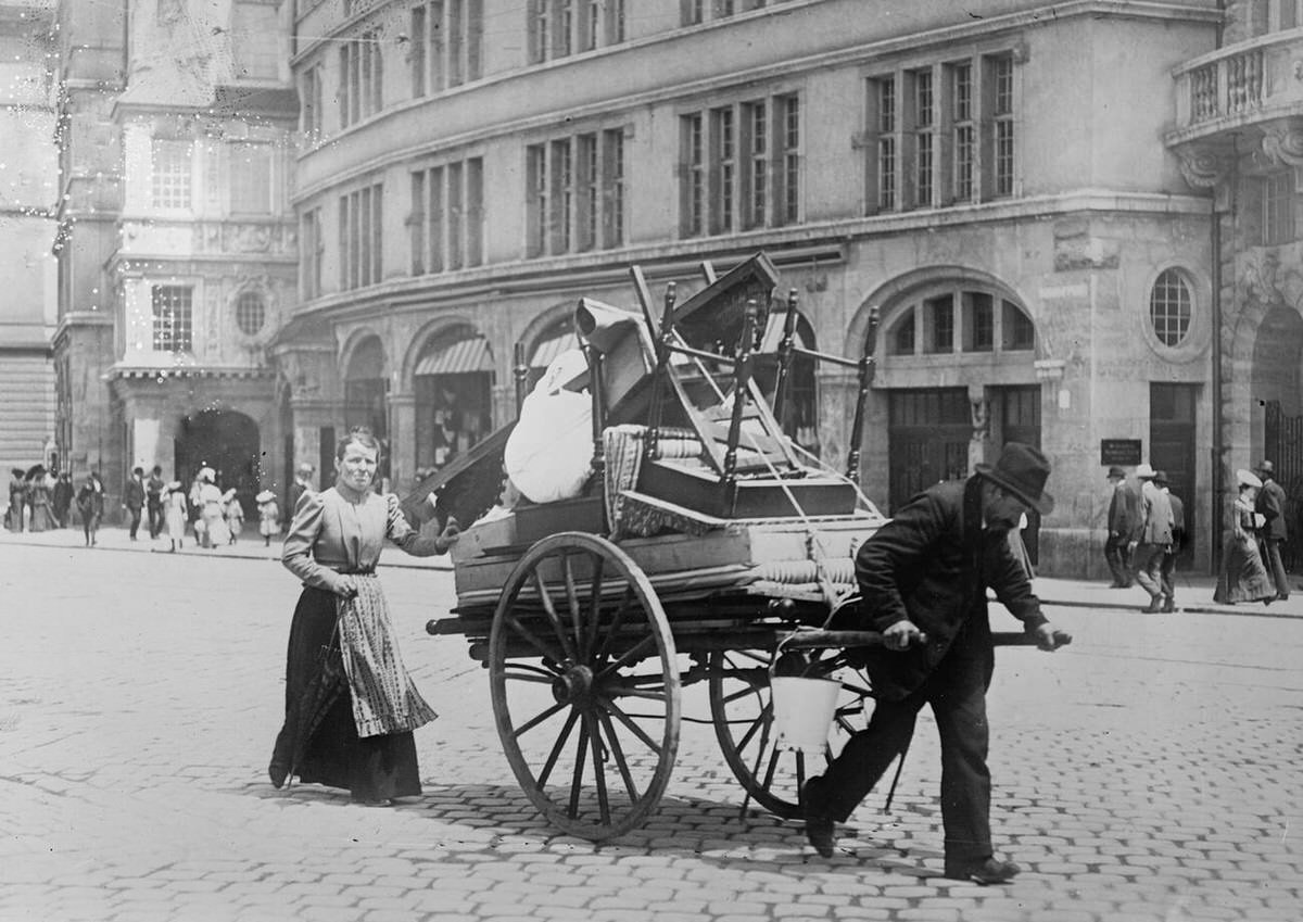 Family moving household belongings through the streets of Berlin, Germany, 1910
