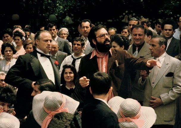 Francis Ford Coppola directing Marlon Brando and the cast in the wedding scene, The Godfather, 1972