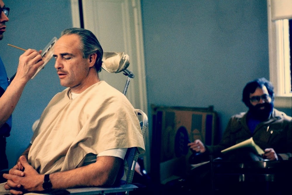 Marlon Brando getting made up as Don Corleone with Francis Ford Coppola in the background, The Godfather, 1972