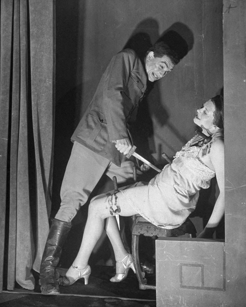 Actor performing a stabbing scene at the Grand Guignol, 1947
