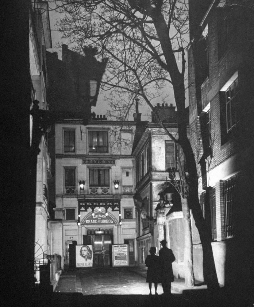 Entrance to the Grand Guignol theater in a gaslit alley in Montmartre, 1947