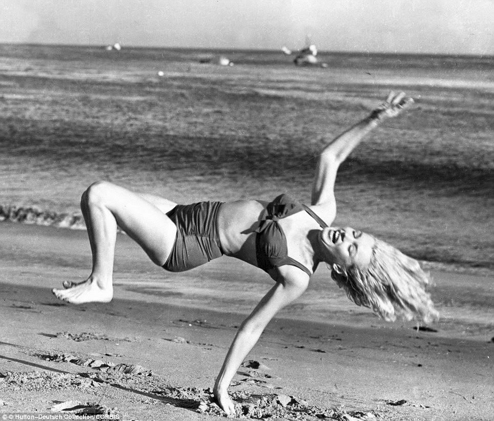 Marilyn Monroe taking a break from filming on a Los Angeles beach, 1950s