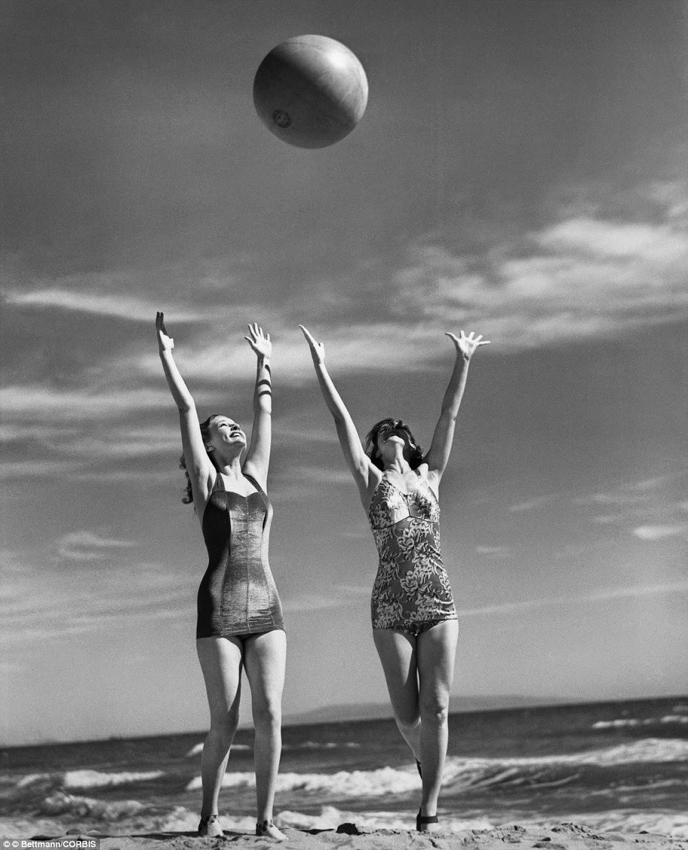 Mary Howard and Ann Morris playing with a ball on the beach, 1941
