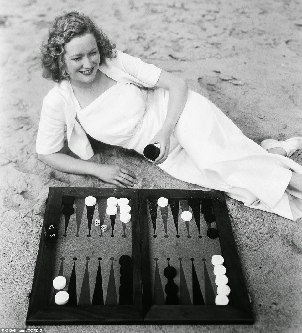 Miriam Hopkins playing backgammon on the beach, The Smiling Lieutenant, 1931