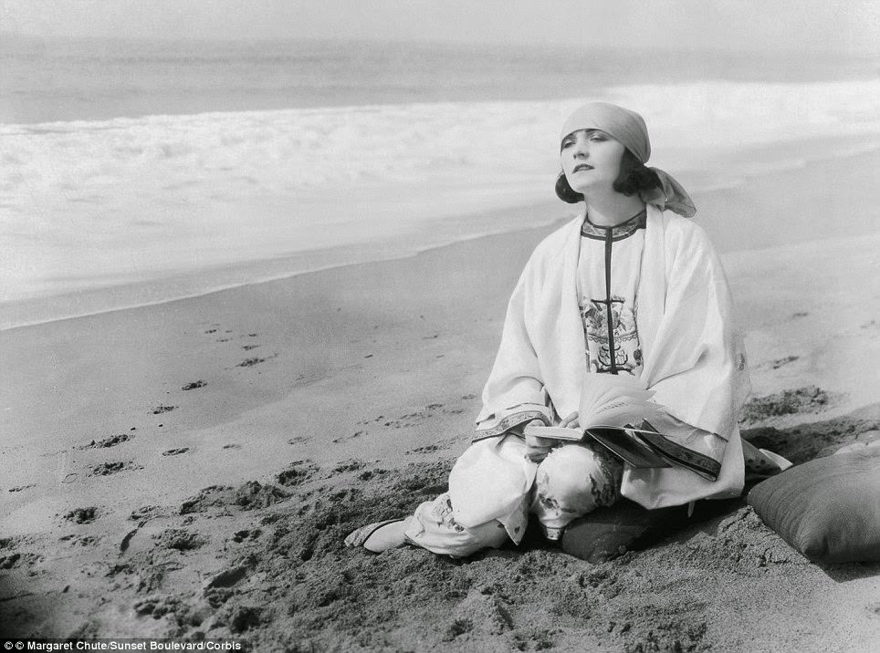 Pola Negri relaxing on the beach at Santa Monica, 1925