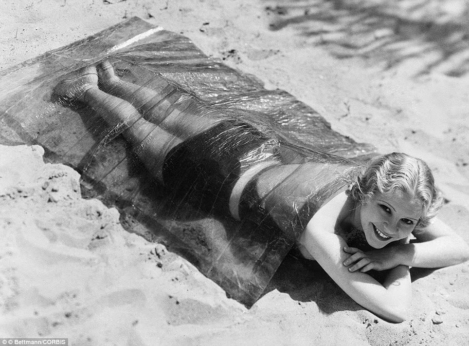 June Clyde demonstrating the use of cellophane to prevent sunburn, 1932