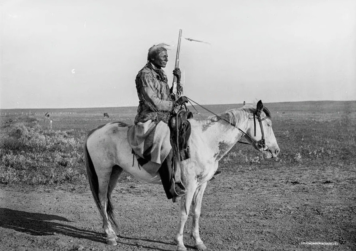 Assiniboine Indian on guard on the outskirts of camp, 1898