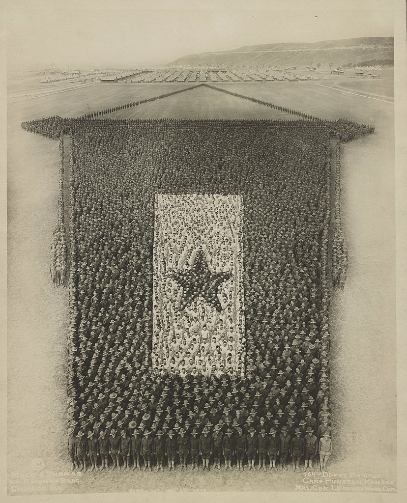 Soldiers of the 164th Depot Brigade, Camp Funston, Fort Riley, Kansas, formed into the shape of the U.S. Armed Forces service flag, 1918.