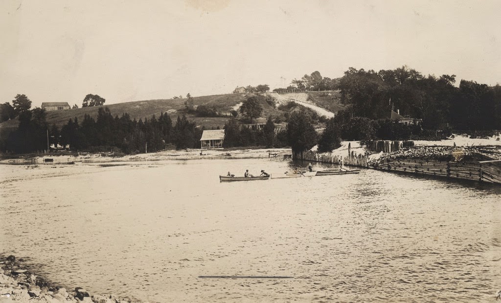 Port Albert harbor with people in three canoes, 1890s