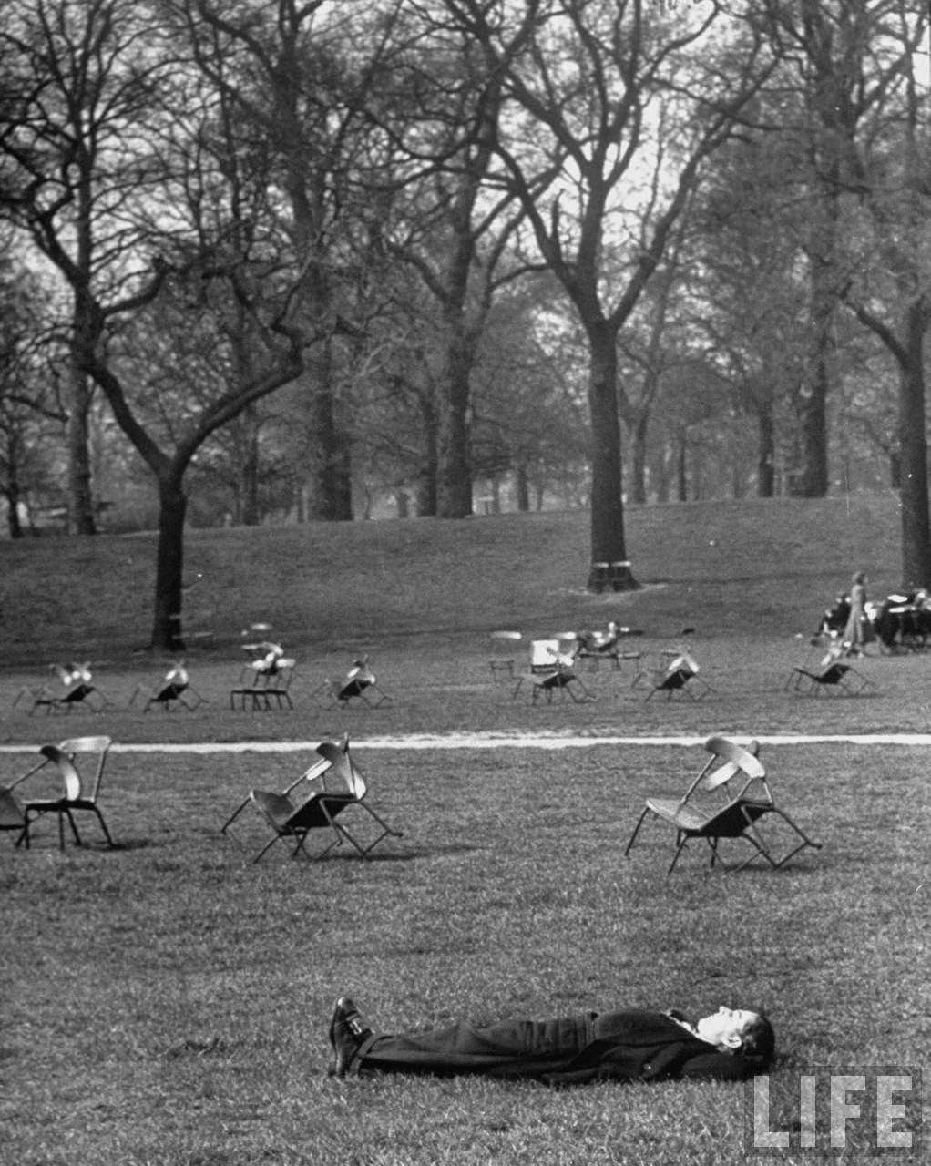 A man napping in Hyde Park.