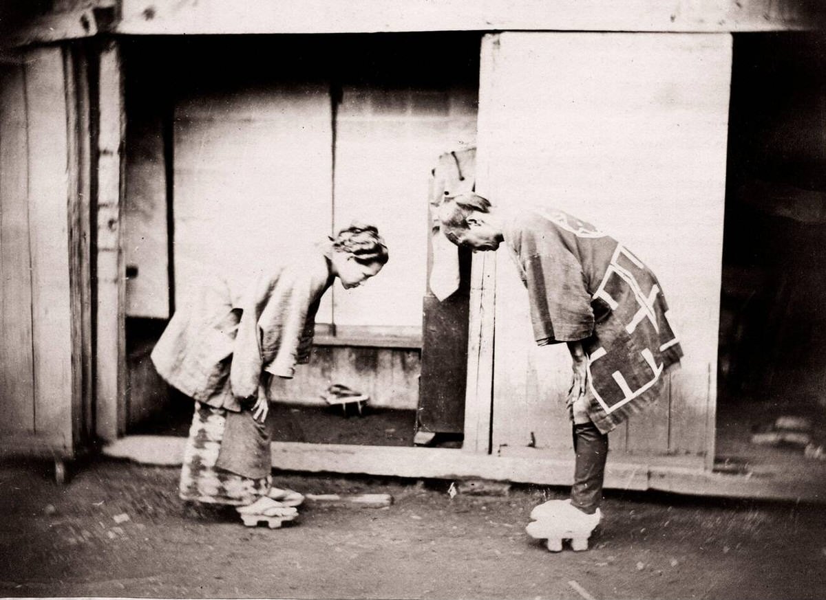 Two people greeting each other.