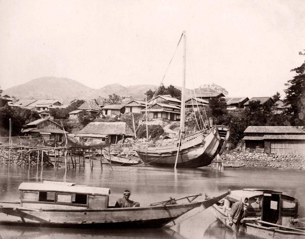 Japanese junk tied up along a bank, 1860s