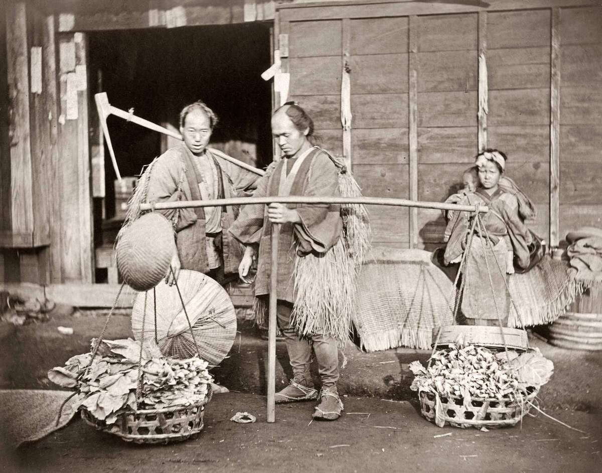 Porter carrying a load of vegetables in Japan, 1870s