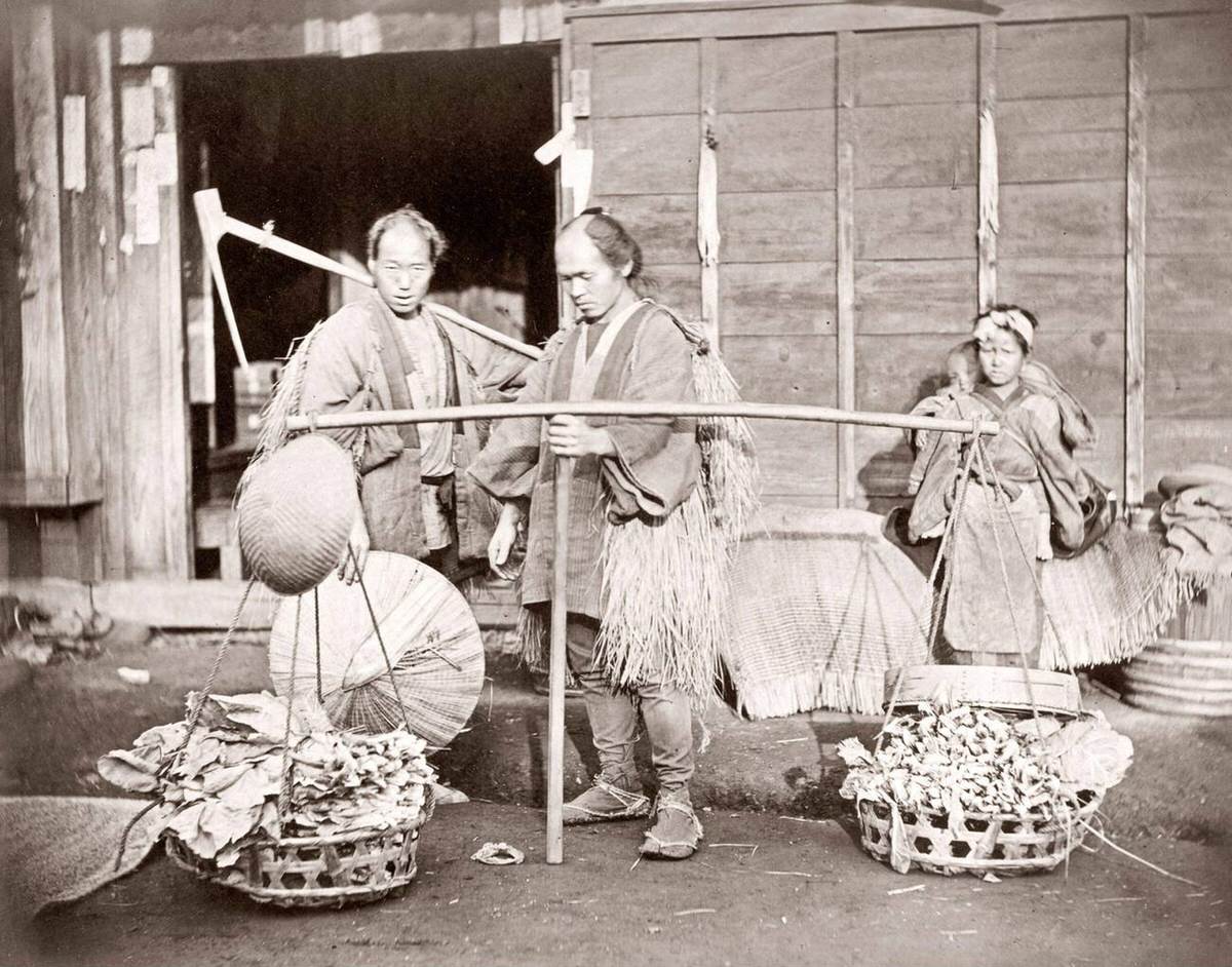 Porter carrying a load of vegetables in Japan, 1870s