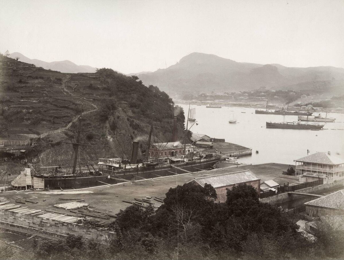 Naval arsenal at Nagasaki with a ship in dry dock, 1890