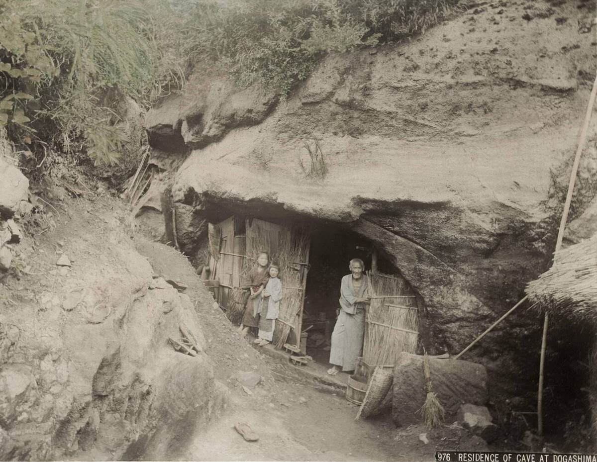 Cave dwellers and rock-carved home in Dogashima, 1880