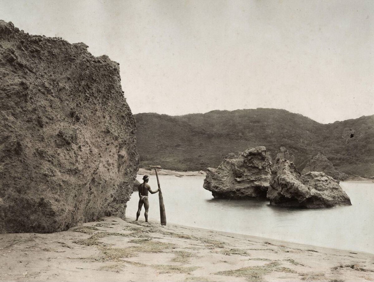 Ainu man with a paddle on Hokkaido, 1880