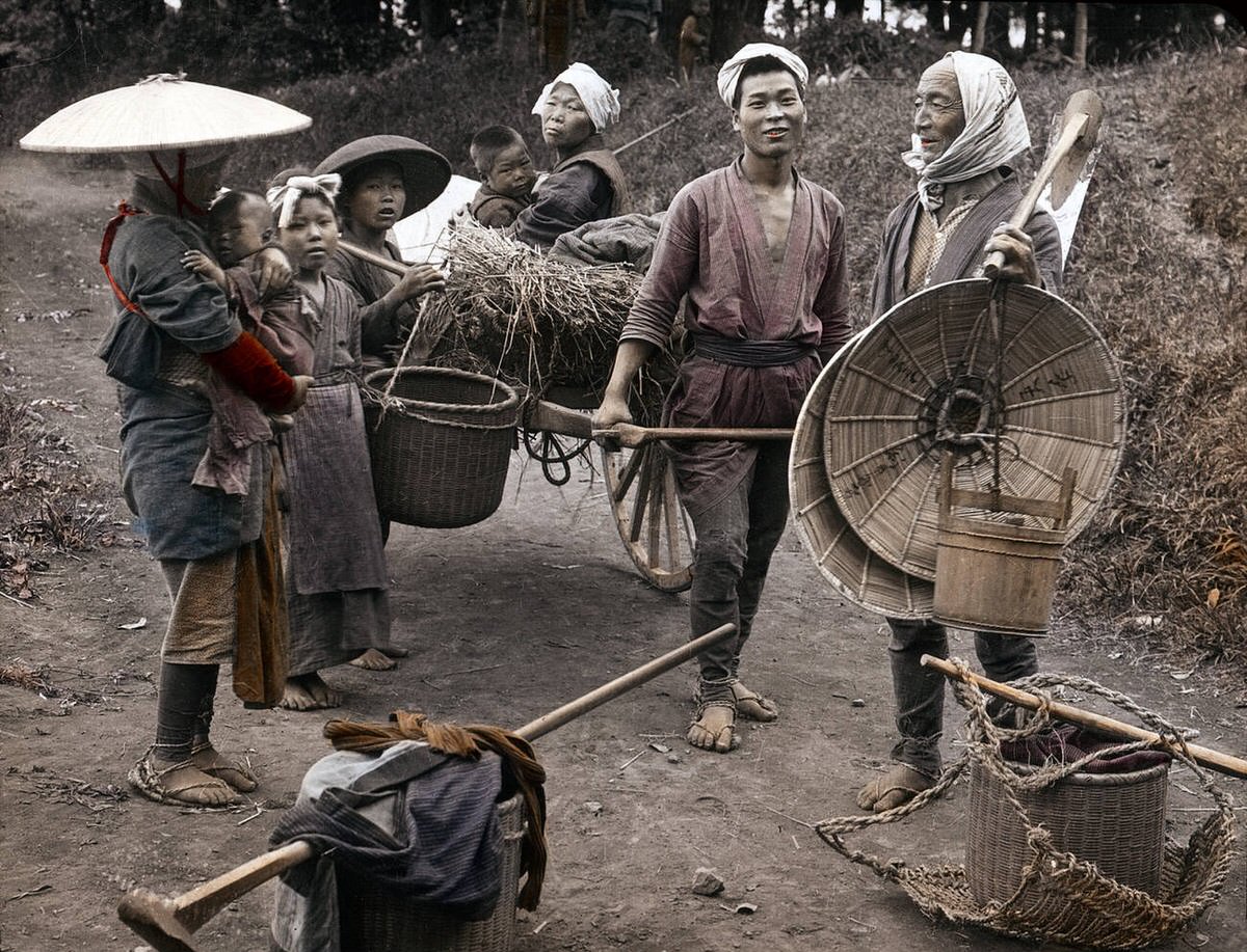 Three generations of a farmer's family with farming tools, 1890s
