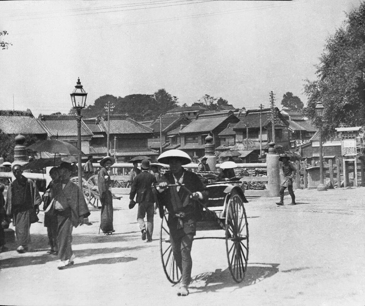 Rickshaw near a bridge in an urban landscape, 1890s