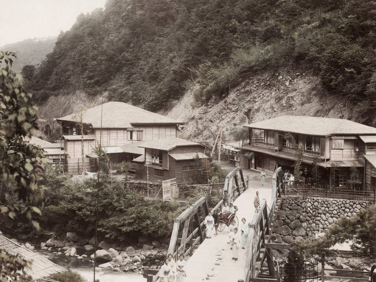 Tonosawa with a footbridge in the foreground, 1880s