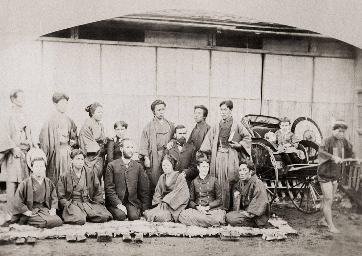 Japanese workers and a missionary family at a Christian mission, 1880s
