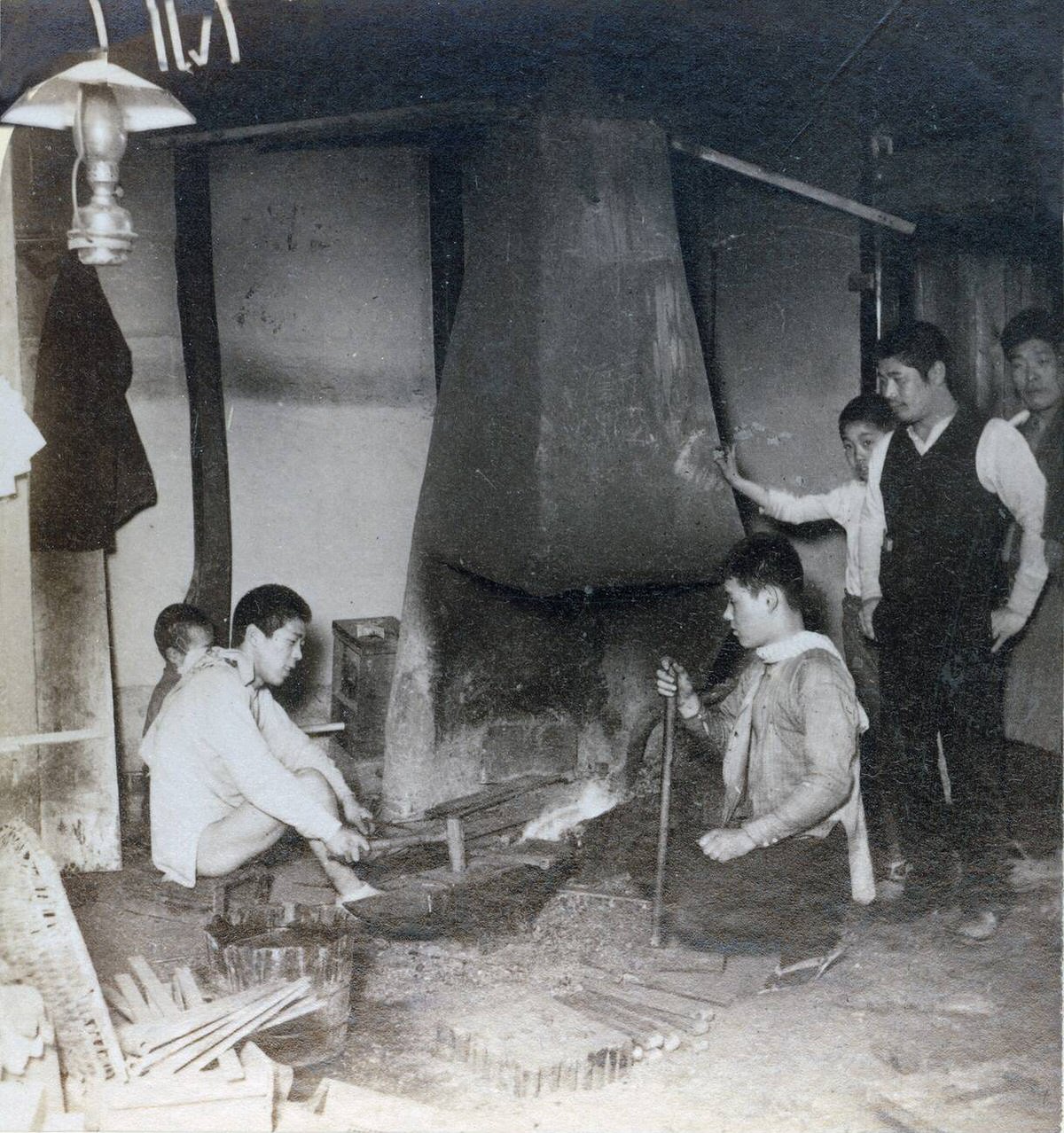 Young Japanese blacksmith at work, 1896