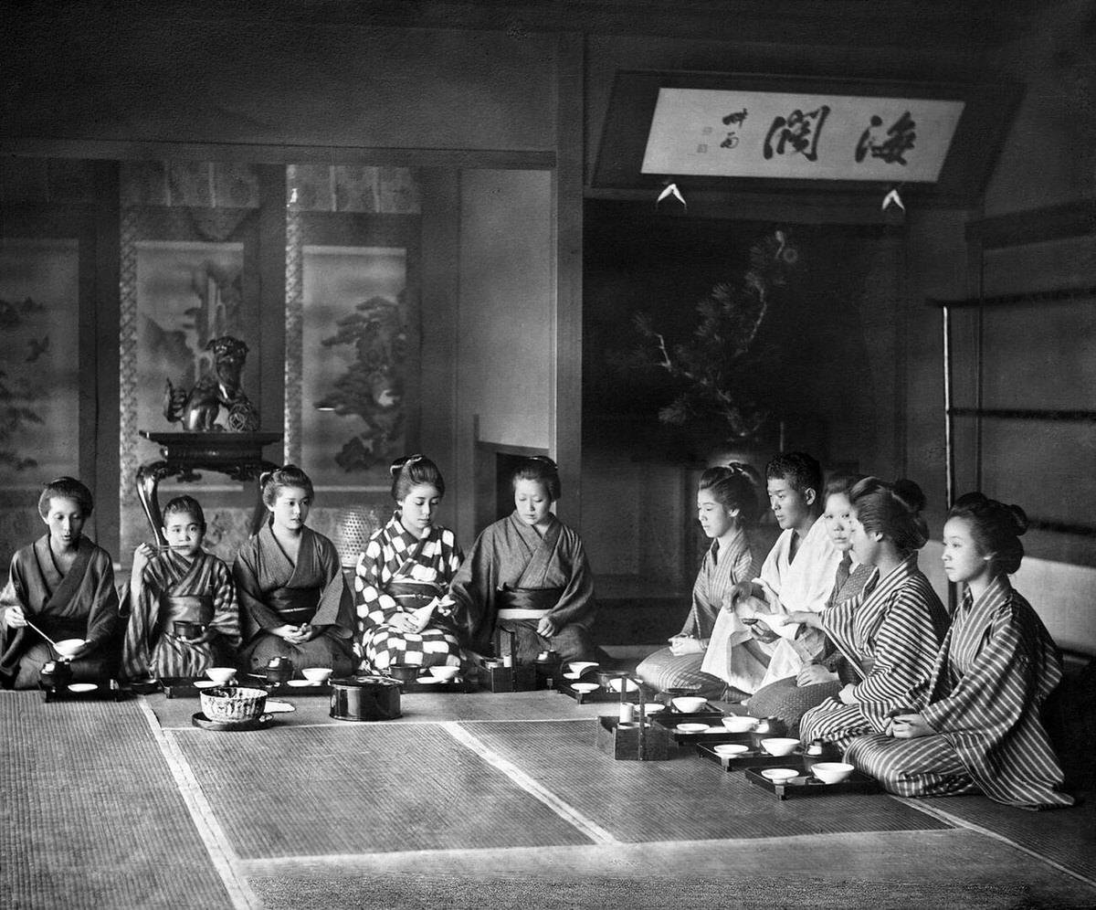 Family having a meal in a traditional Japanese room, 1890s