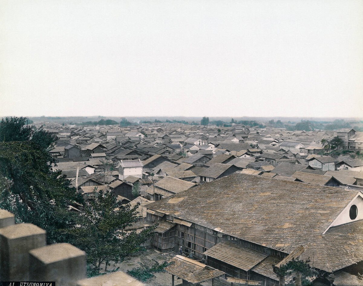 General view of Utsunomiya with carpenters at work, 1890s