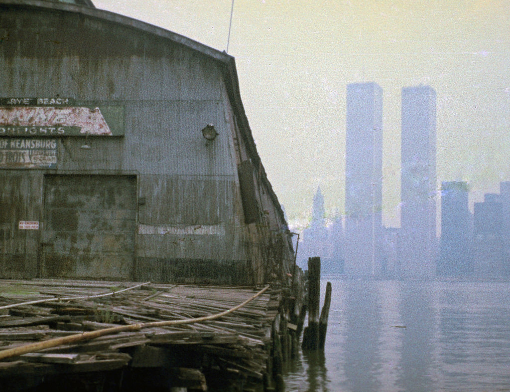 Abandoned pier at Exchange Place in Jersey City with the World Trade Center across the Hudson, 1975
