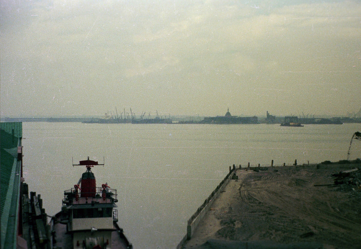 Railroad ruins and crane graveyards in Jersey City seen from Pier A in Manhattan, 1975