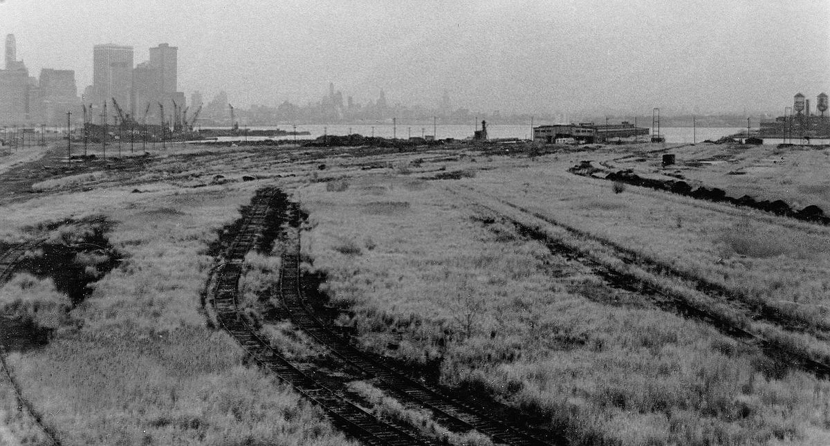 Abandoned Central Railroad of New Jersey tracks and a crane graveyard in Jersey City, 1976