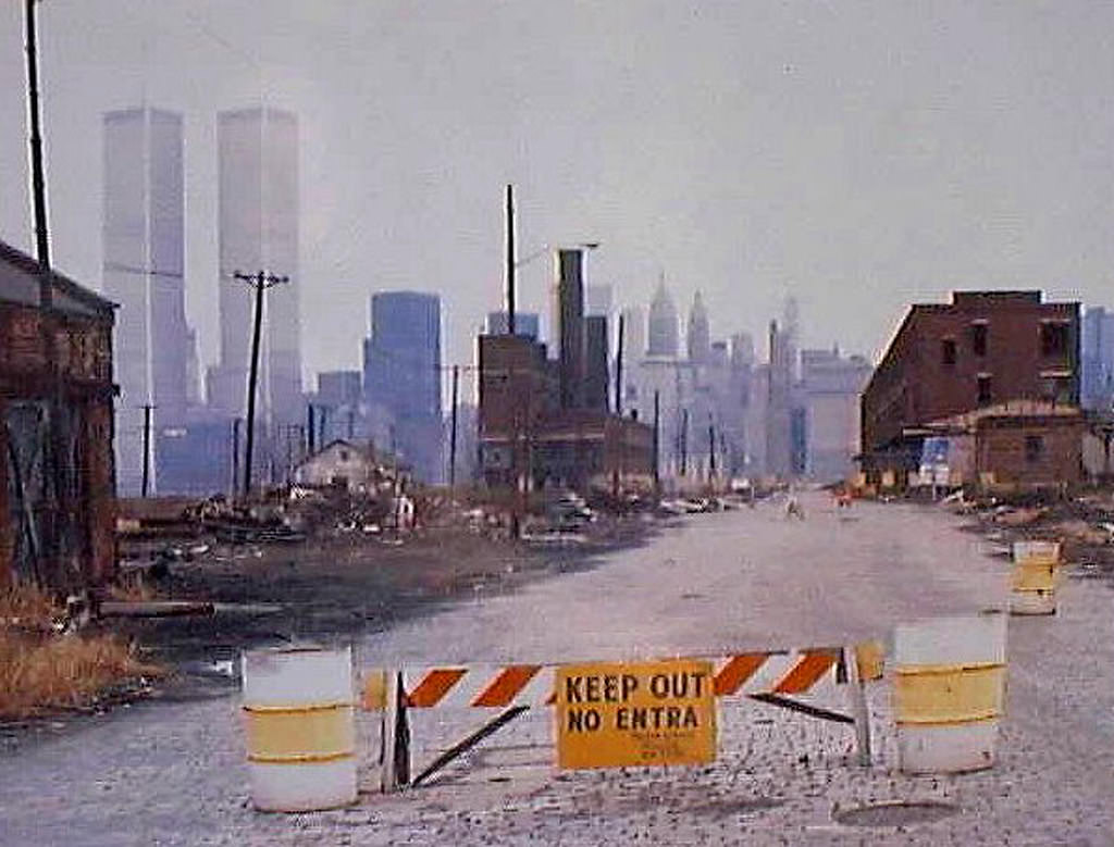 Abandoned Central Railroad of New Jersey Terminal with the World Trade Center in the background, 1976