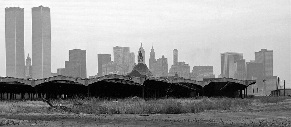 Ruins of the Central Railroad of New Jersey terminal with the World Trade Center in the background, 1978
