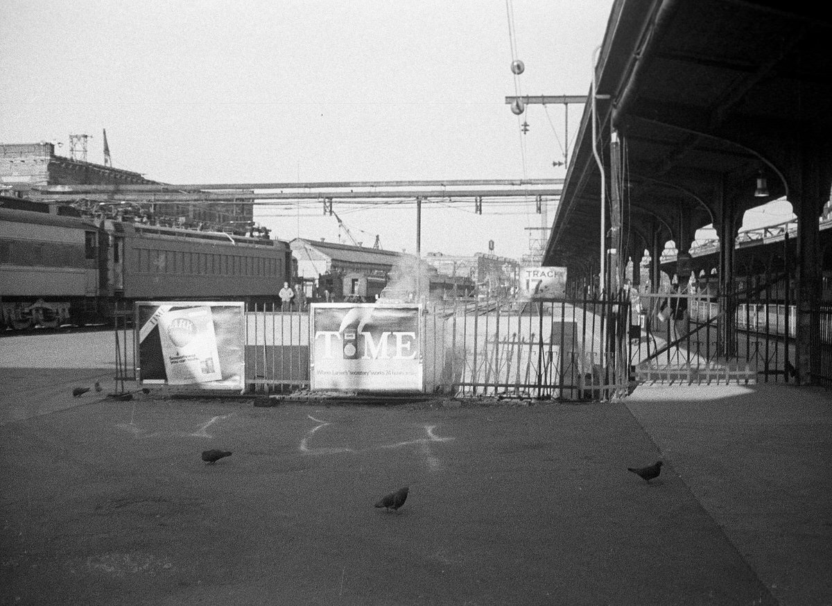 Hoboken Erie Lackawanna Terminal with vintage trains and cigarette advertisements, 1975