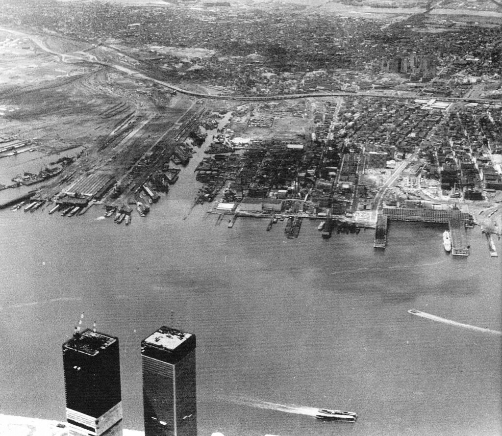 Abandoned Jersey City railroads and piers with the World Trade Center under construction, 1970