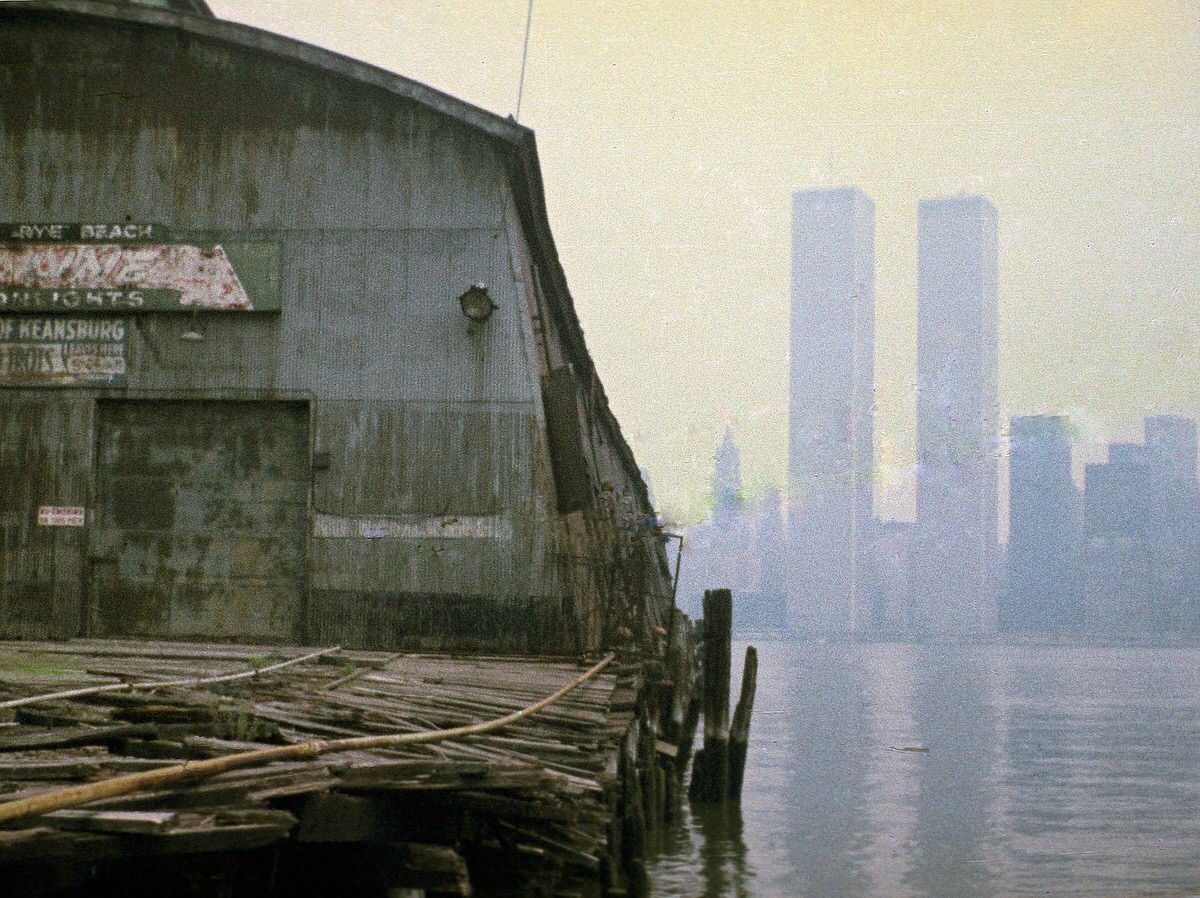 World Trade Center seen from the ruins of the Erie Railroad piers at Exchange Place, 1975