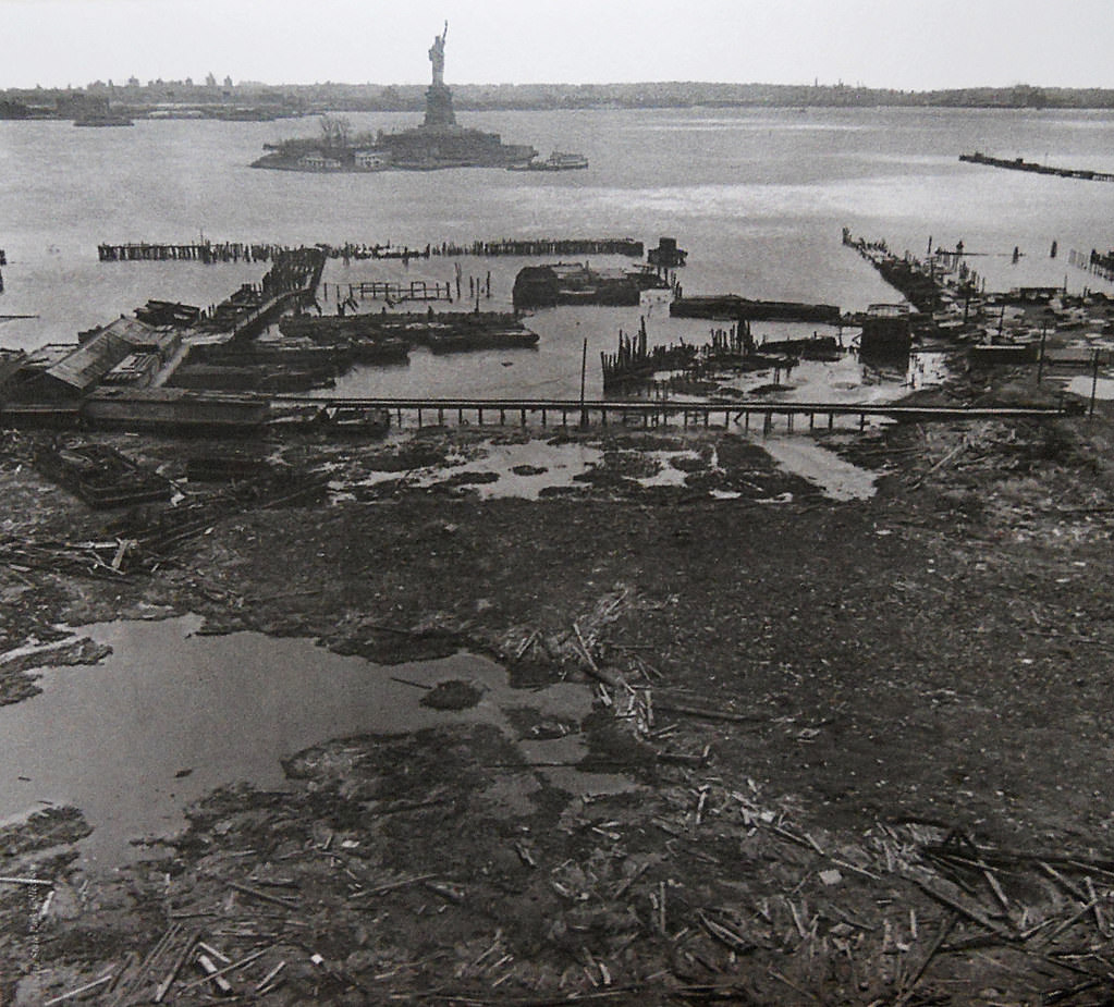 Statue of Liberty and abandoned railroad ruins at Black Tom in Jersey City, 1975