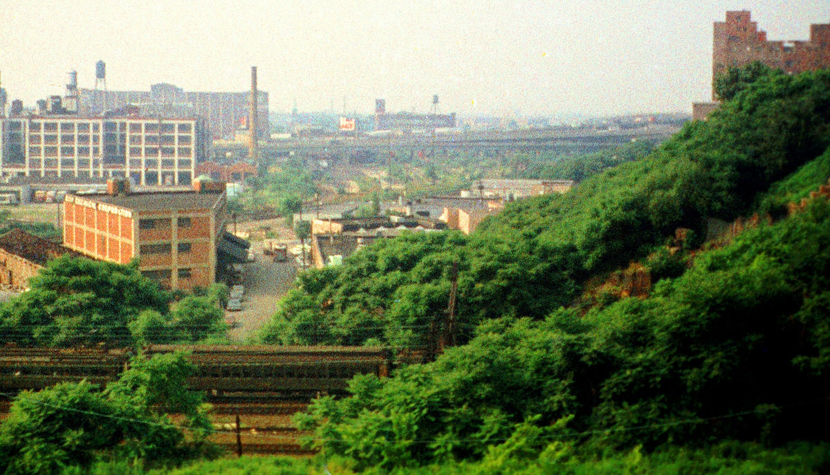 Erie Lackawanna commuter train and industrial ruins in Jersey City, 1975