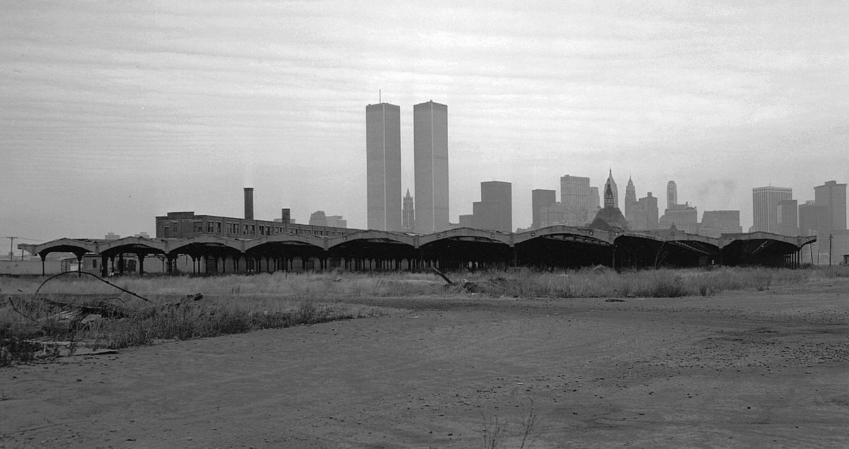 Ruins of the Central Railroad of New Jersey terminal with the World Trade Center in the background, 1977