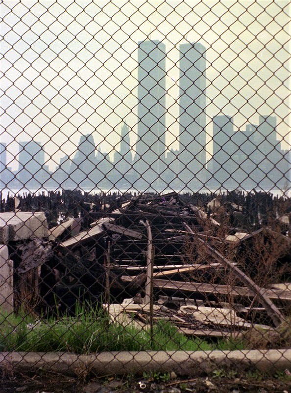 Lower Manhattan skyline seen from the pier ruins at Exchange Place in Jersey City, 1975