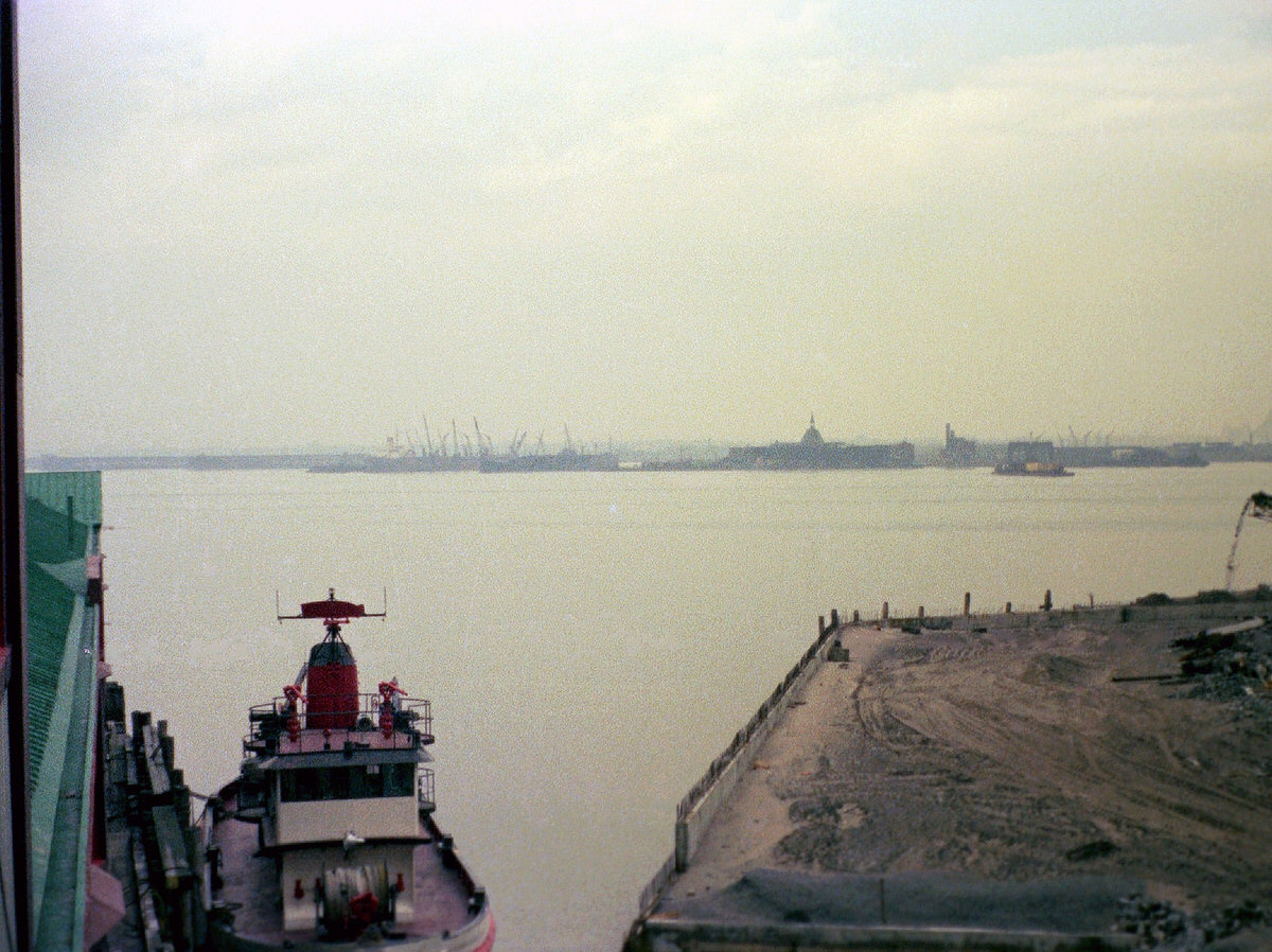 Jersey City industrial wasteland and the Central Railroad of New Jersey terminal seen from Pier A, 1975