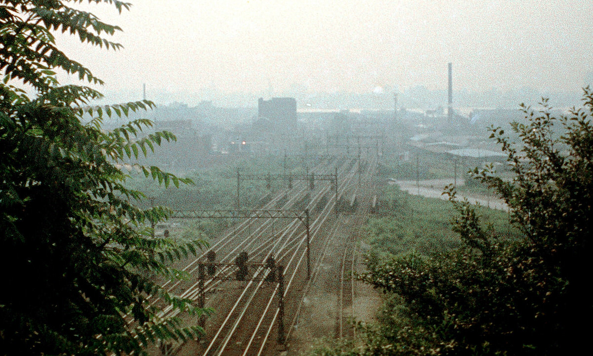 Erie Lackawanna railroad tracks and the Manhattan skyline seen from Bergen Hill, 1975