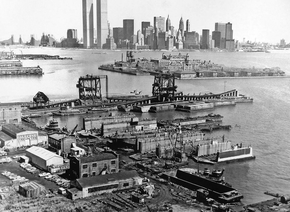 Abandoned railroad yards and Ellis Island seen from the Jersey City shoreline, 1973