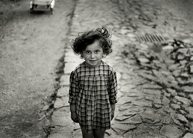 Girl in a plaid dress, Mukacevo, Ukraine, 1930s.